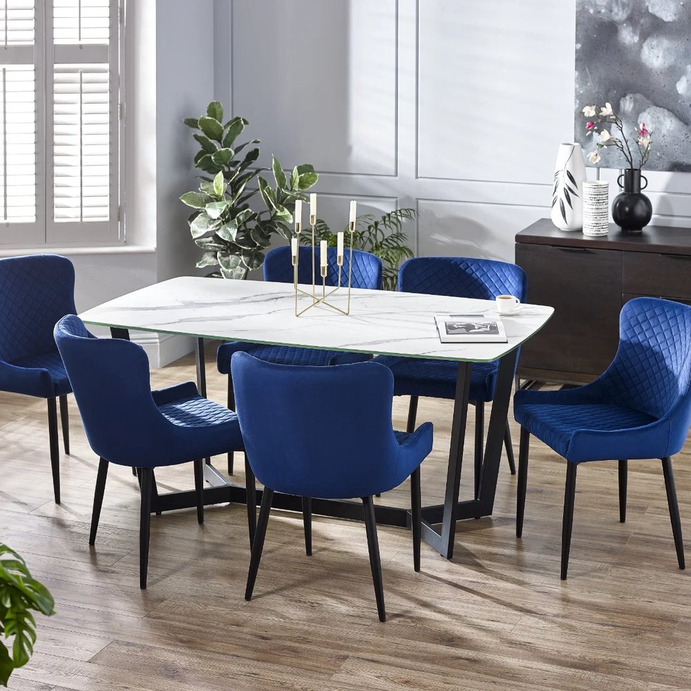 Olympus marble-inspired dining table with blue dining chairs