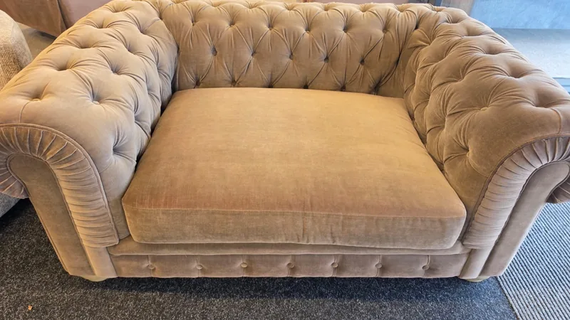 Taupe button-tufted Chesterfield love seat, in our Cleveleys showroom