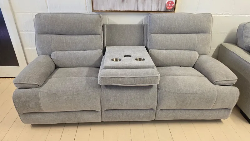Grey fabric recliner 3 seater sofa with a drop-down drinks console and cup holders, in our Cleveleys showroom