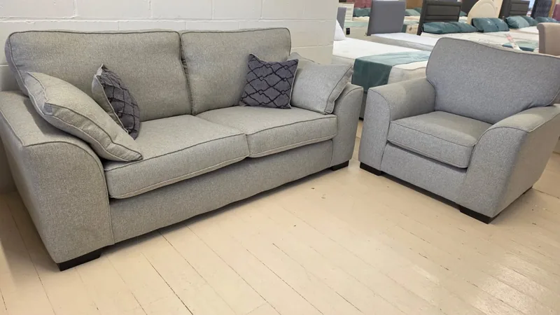 Light grey fabric 3 seater sofa and matching armchair, in our Cleveleys showroom